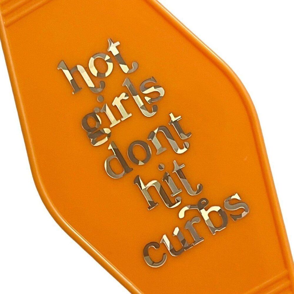 Orange Motel Room Keychain   Holographic print says “hot girls don’t hit curbs”